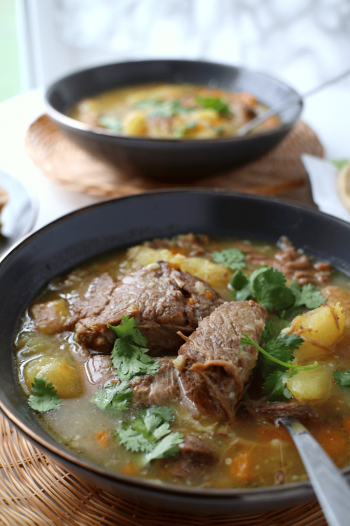 close up latin beef soup bowl with another bowl in background